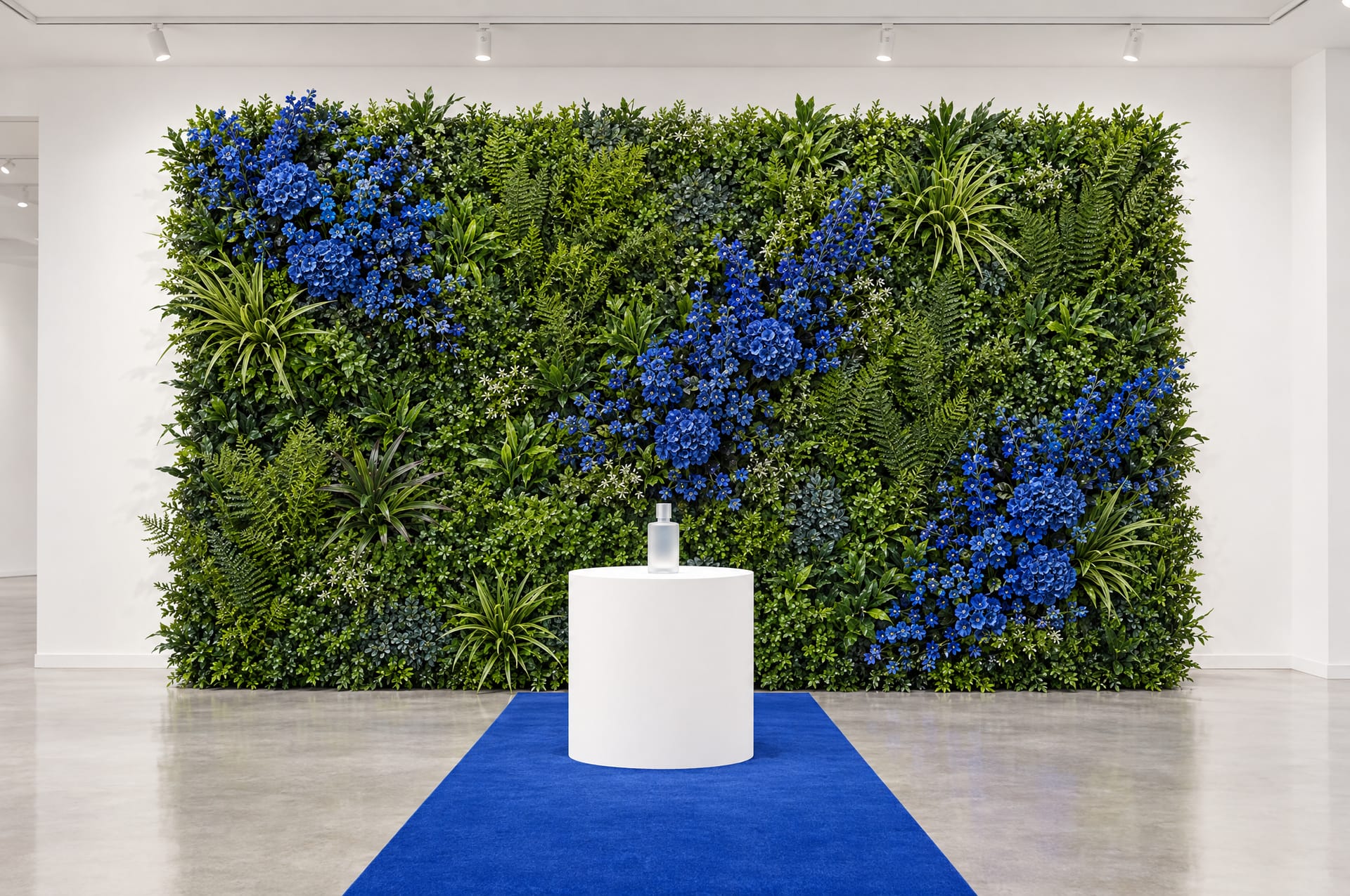 Brand launch green wall with drifts of cobalt blue custom-coloured flowers